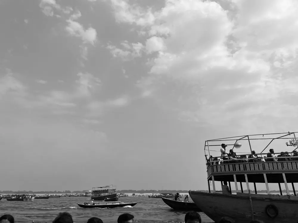 Black and white boat near the ghats